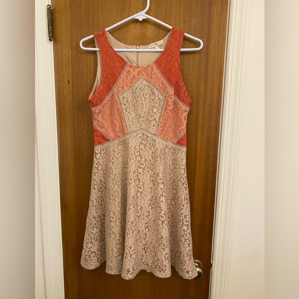 Beautiful Lacey, orange and cream colored dress for juniors. Size medium